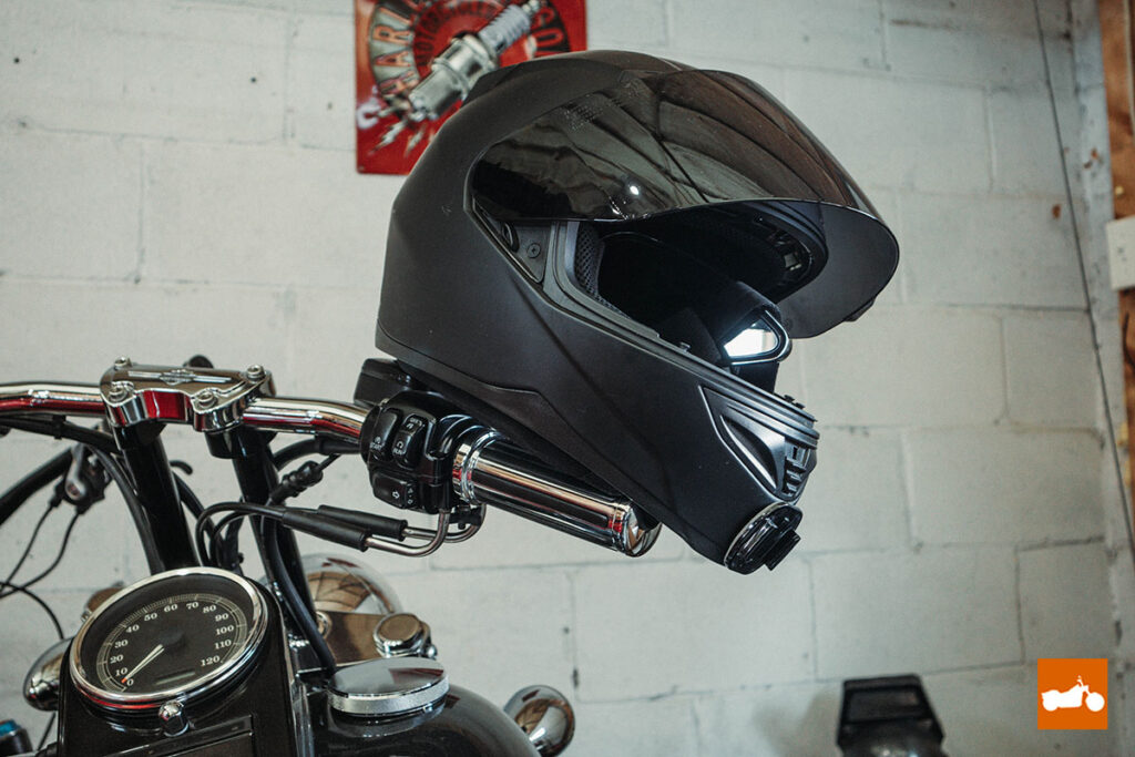 Black helmet on Harley Davidson handlebars